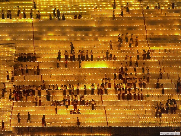 Lighting candles in Magwe, Mandalay region, Myanmar photo