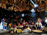 Padaung women preparing food, Myanmar (Burma) Photo