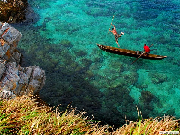 Spear fishing near Kawthaung, Myanmar photo