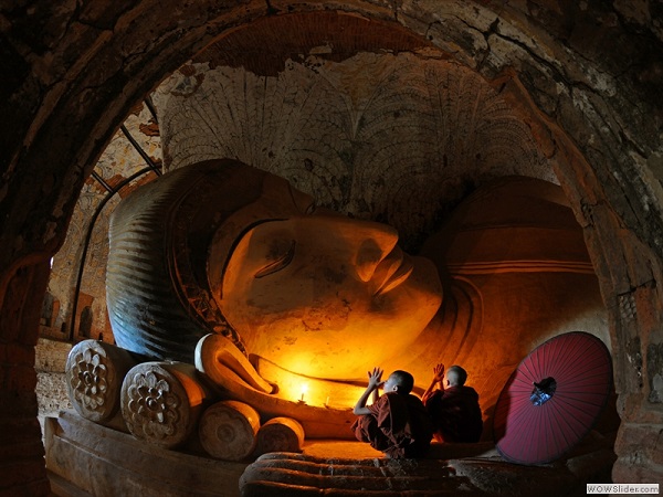 two novices pay homage to Buddha image, Myanmar photo